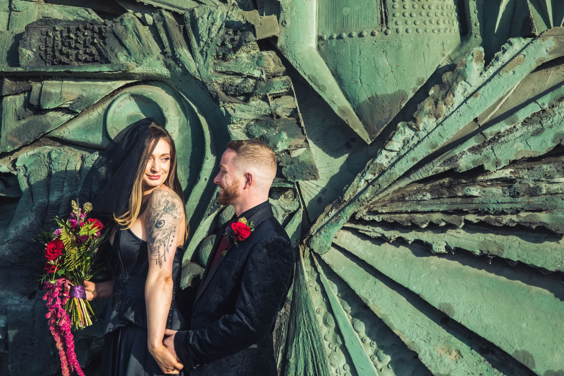 A tattooed couple at their wedding
